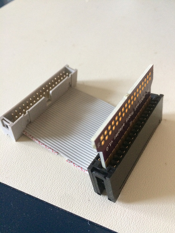 v1.0 board plugged into a 5.25" floppy edge connector