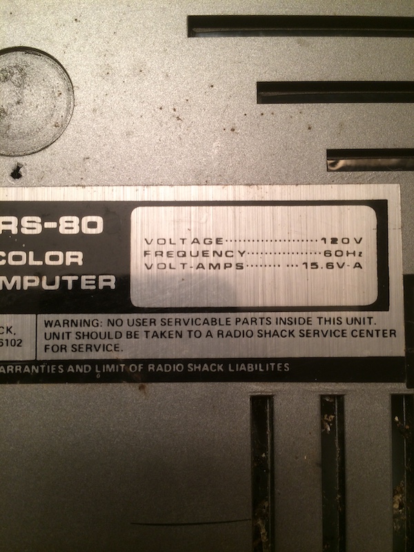 CoCo warning sticker - No user servicable parts inside this unit. Unit should be taken to a Radio Shack Service Center for service. Voltage 120V, Frequency 60Hz, Volt-Amps 15.6V - A