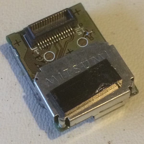 This wifi module reads 'MITSUMI' on it and has a similar connector to other Mitsumi interconnect boards we've seen on the Super Famicom and Sharp X68000
