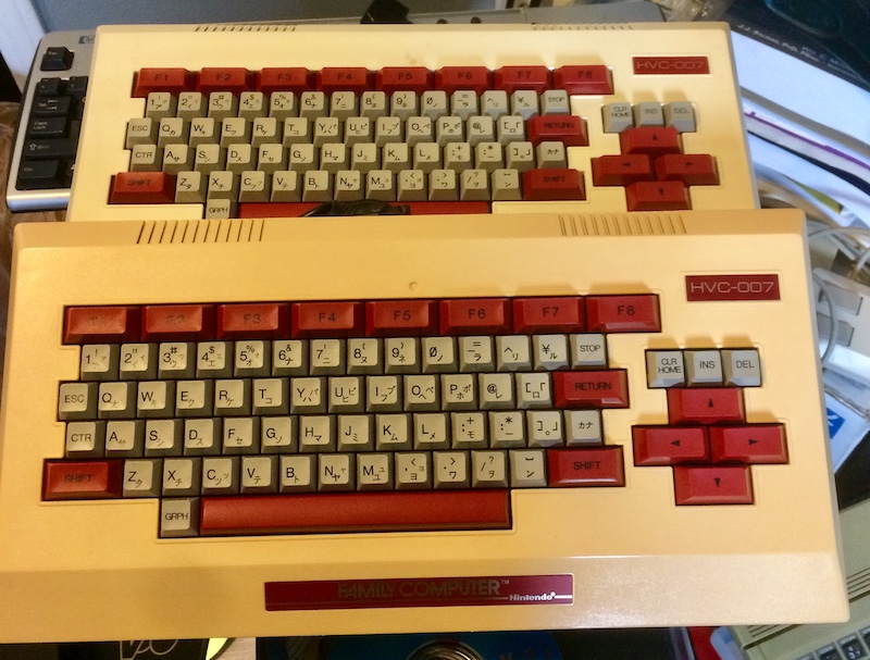 Just two of the yellowed Family BASIC keyboards that consume my storage area.