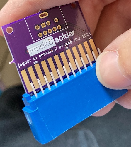 The edge connector is press-fit against the bottom of the board. You can see that the straight pins are nowhere near the solder pads on the board.