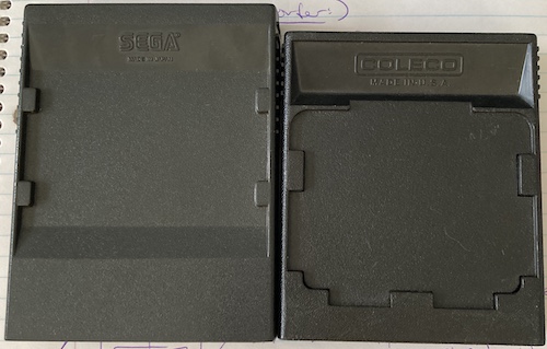 The back of the Mark III and ColecoVision cartridges. Similar styling tabs are present, along with ramps for grabbing the cartridge out.