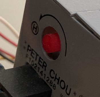 The +5V regulation dial on the "PETER CHOU" brand power supply inside the Neo-Geo cabinet. Turning it counter-clockwise is "H," for what I assume is "H"igher voltage. Do not put it in "H."