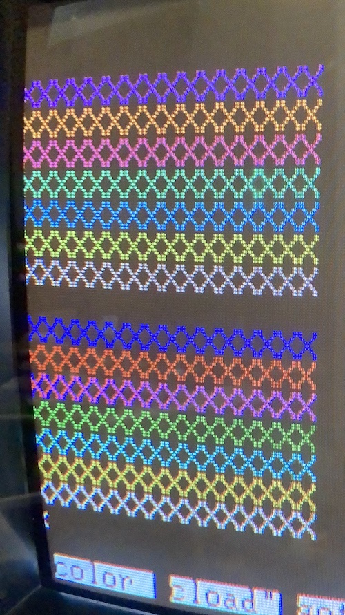 The PC-TV151 monitor that was intended to be paired with the PC-6601SR is showing off a row of coloured "Xs" going down the screen. They are different, more pastel-y colours than the MultiSync 3D is picking, including some pinks and purples.
