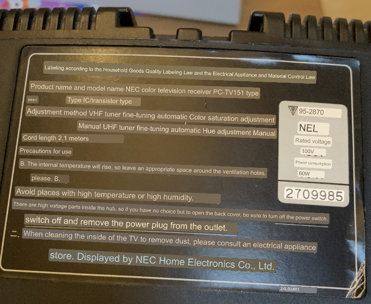 The warning sticker on the back of the case. It tells me that if I have no choice but to open the back cover, I should at least unplug and switch it off first.