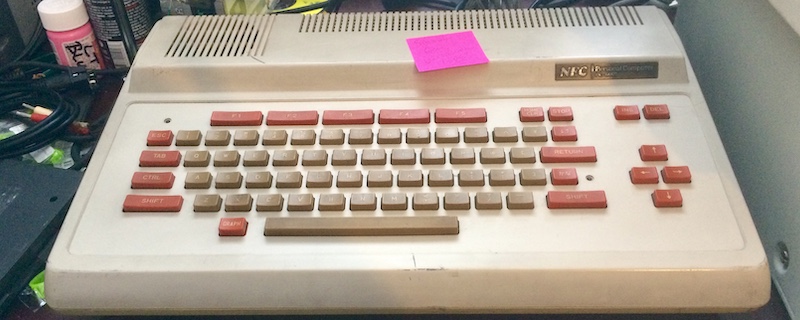 The PC-6001 sitting on my desk, ready for more adventure. The sticky note says 'sound gone - maybe electrolytic caps?'