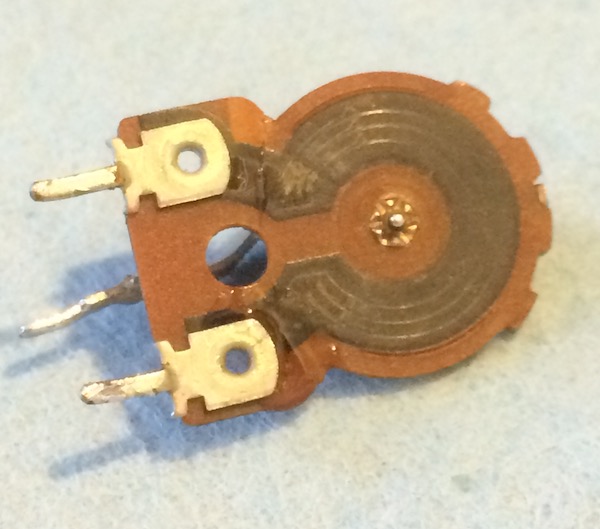 The potentiometer substrate is glued back together. You can faintly see some wetness of the not-yet-dry super glue.