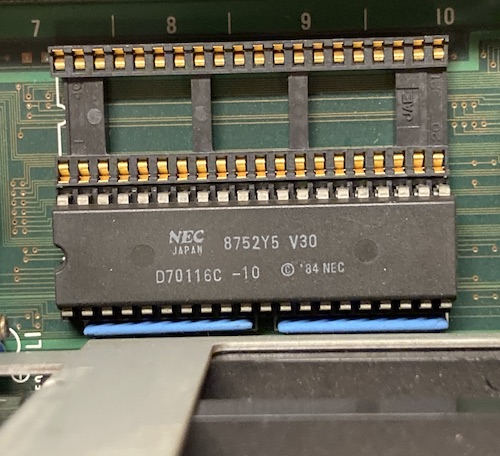 A late 1987-build plastic package NEC V30 and empty (gold!) DIP socket next to it.