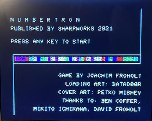 The Numbertron title screen, saying game by Joachim Froholt, Loading art by Datad00r, Cover art by Petro Mishev, Thanks to: Ben Coffer, Michito Ishikawa, David Froholt.