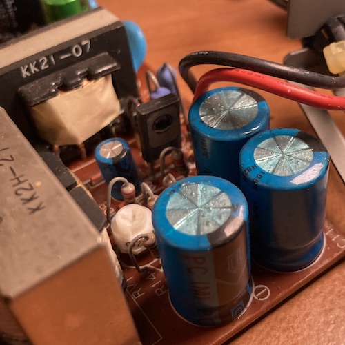 Some suspicious blue tint is observable on the top of these 1000µF capacitors.