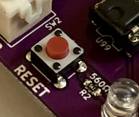 The reset button. It is a red 6mm tac switch next to the legend saying "RESET." This is the most interesting picture on my blog.
