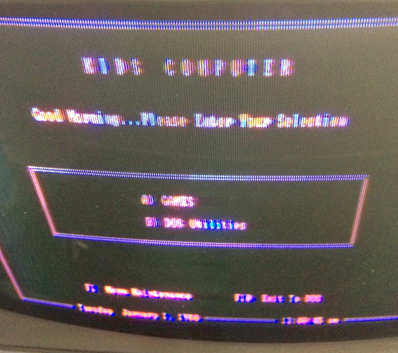 The Tandy 1000TX startup menu. It says KIDS COMPUTER and then Good Morning... Please Enter Your Selection A) Games B) DOS utilities