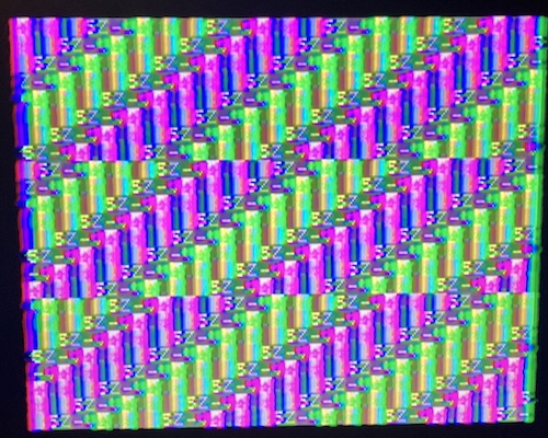 A bunch of cascading green and purple waterfalls fill the screen with the letters "SZ-" repeated often on each cycle.
