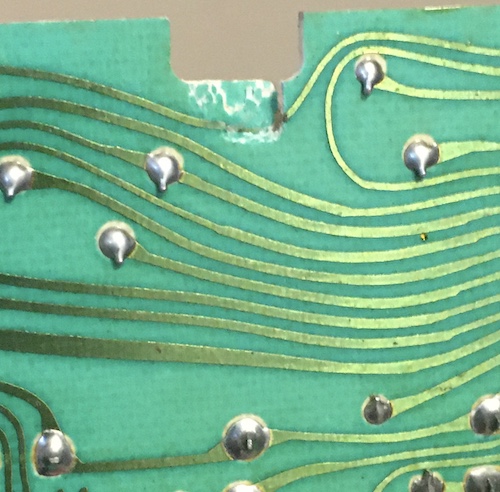 There's a bad crack in the keyboard PCB near the mounting post, that has severed a trace.