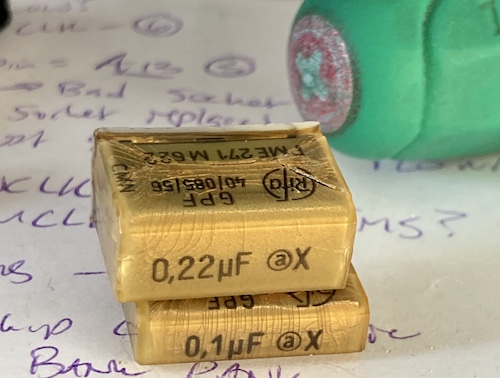 The two yellowed RIFA X caps have been removed from the system. One is 0.22µF and the other is 0.1µF.