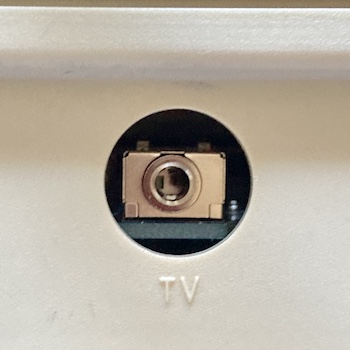 The new 3.5mm TRRS jack is perfectly centered in the "TV" hole of the case during a test fit.