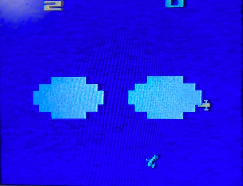 A yellow airplane is coming out of a cloud, and a blue airplane is flying towards the earth.