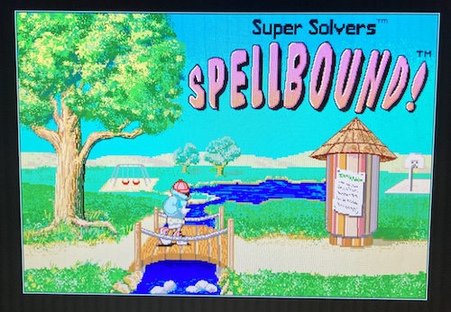 The title screen for Spellbound! - an anonymous winter-jacketed Super Solver strides towards an ominous help-wanted sign. He's going to the White House... if he can defeat some robots who are bad at spelling.