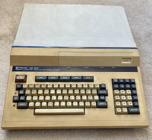 The MB-6891, sitting on my carpet. It's got a full keyboard and it's very long and very wide.