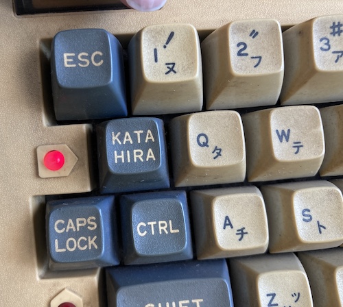 The katakana mode is engaged, showing a red light next to the KANA/HIRA key.