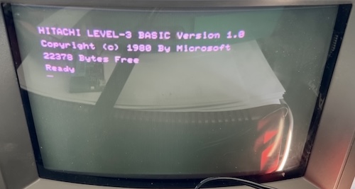 The computer is working, and displays "Hitachi LEVEL-3 BASIC Version 1.0, Copyright 1980 by Microsoft, 22,370 bytes free.