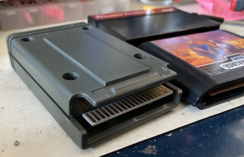 The "skirt" cutout, exposing the edge connector from the corners.