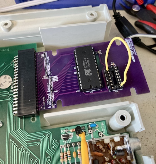 A yellow jumper wire is stuck from pin 1 of the 74ls08 to pin 8 of the 74ls08 in order to immediately map the chip-select input onto the ROM.