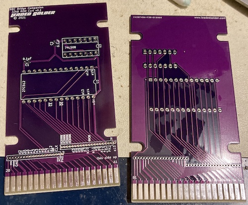 The "dumb" 64kB ROM board, in glorious royal purple colour. It has a 74LS08 and a socket for a 27c512.