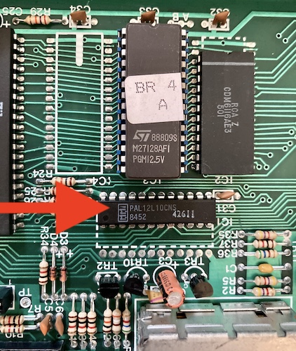 A red arrow points to the PAL12L10CNS that does decoding