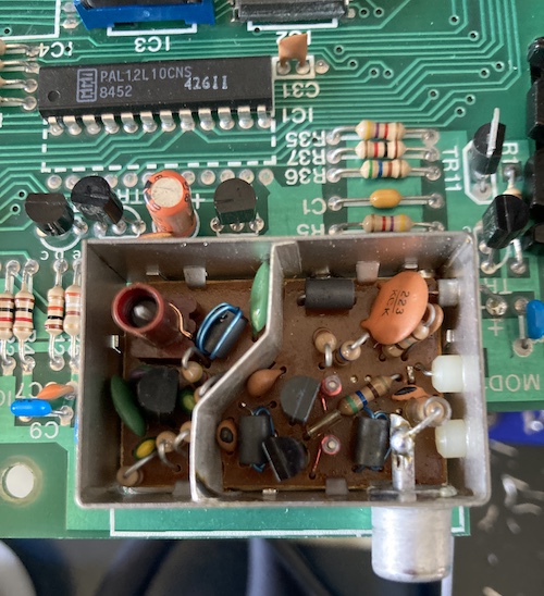 Inside the Astec UM1233 RF modulator. The rearmost pin (+5V) and the middle pin (RF-ready video) are connected to the motherboard.
