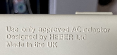The bottom of the case says: "Designed by HEBER Ltd."