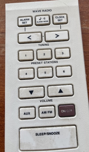 The rubber membrane pad, prior to cleaning. You can tell there's a lot of dirt on the "5" and "1" presets, ON/OFF, and the snooze button of course.