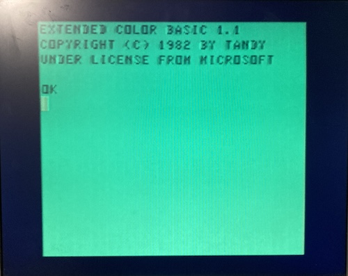Extended Colour Basic has loaded. It says "Extended Color Basic 1.1 Copyright (C) 1982 by Tandy, under license from Microsoft. OK.