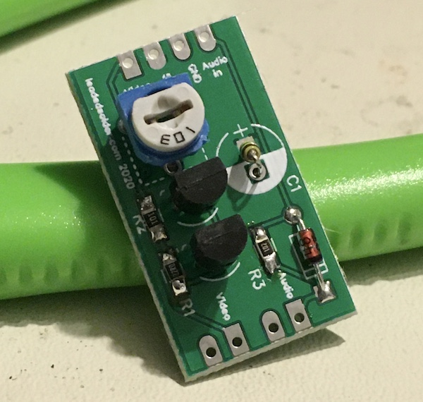 The assembled board. It looks very good, except for the tiny 0.1µF axial bead capacitor sticking out of the place where a polarized electrolytic can should go.