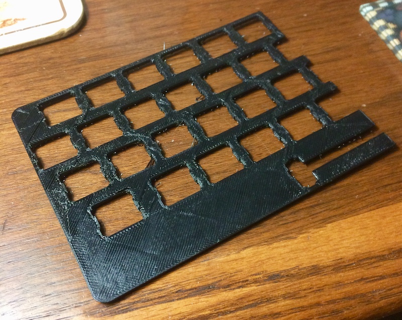 Half a keyboard frame, in black ABS