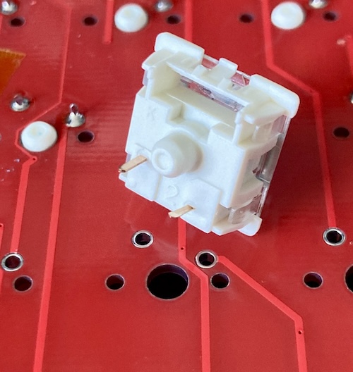 The footprint has extra holes on the side for mounting, but the switch does not have a corresponding tab to hold it in place.