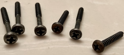 The screw heads are much cleaner. Two are still rusty.