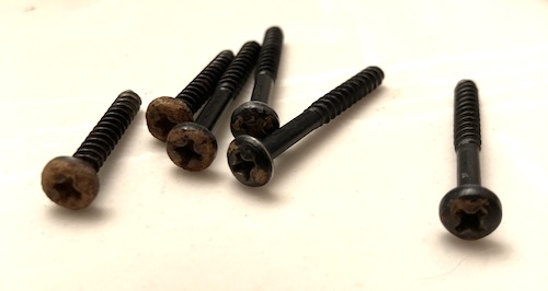 Some rusty case screws sitting on my bathroom counter.