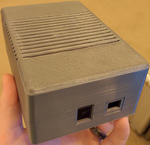 The 3D-printed enclosure, modelled by my buddy's hand.