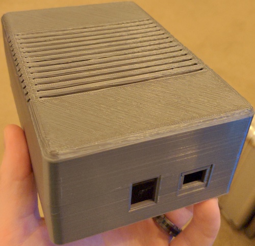 The 3D-printed enclosure, modelled by my buddy's hand.