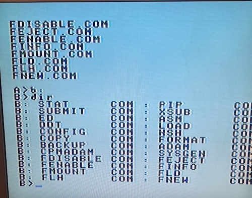 CP/M is loaded on the Coleco ADAM in giant text. I am showing a directory listing of the B drive.