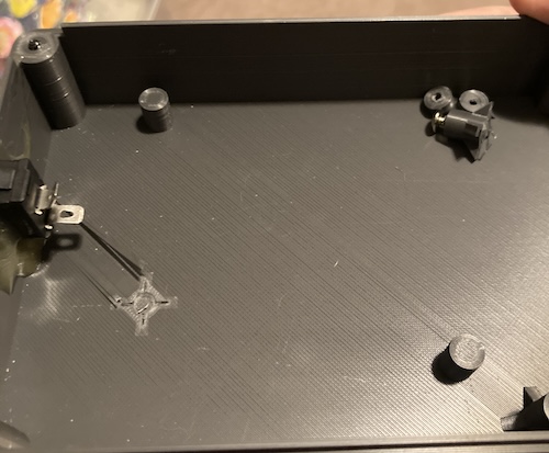 The rear post has broken clean off, and even peeled up the layer of plastic on the way out.