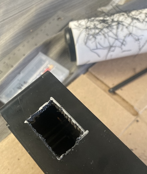 The rough hole, and a lint roller covered in plastic chips, are shown.