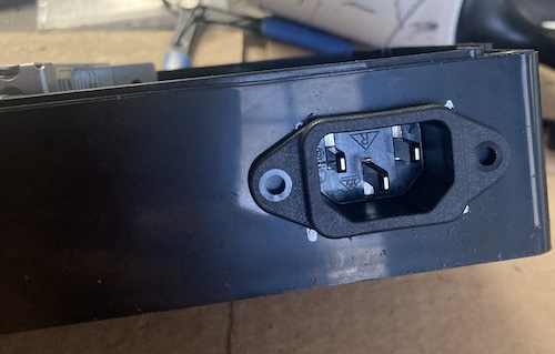 The IEC connector is shoved into the case. It looks incredibly good.