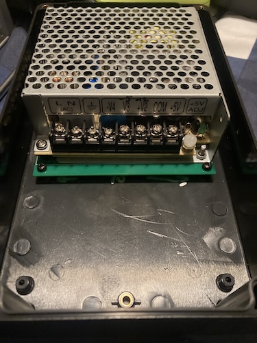 The RQ-50B is sitting in the power supply case, screwed into the front holes.