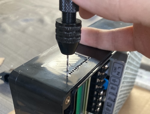 A bunch of holes are stitched into the side of the case around the Sharpied section.