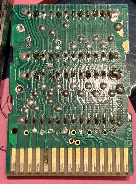 The corrosion on the backside of the cartridge. Note the severe damage to pin 21, also known as address bus pin 5 (pins alternate side-to-side on a Coleco cartridge, like on a floppy disk connector.)