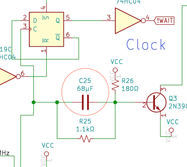 The 68µF capacitor in question, nestled between a 2n3904 transistor and some flip-flops.