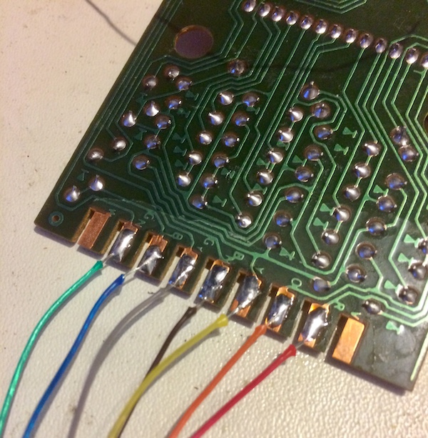 The wires soldered to the ColecoVision controller PCB. The PCB calls out the colour of each wire.