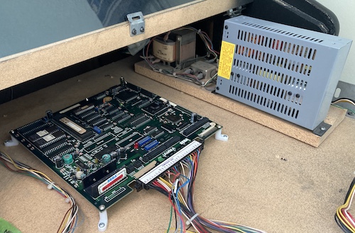 The Columns PCB is screwed into the plywood board holder of the arcade cabinet.